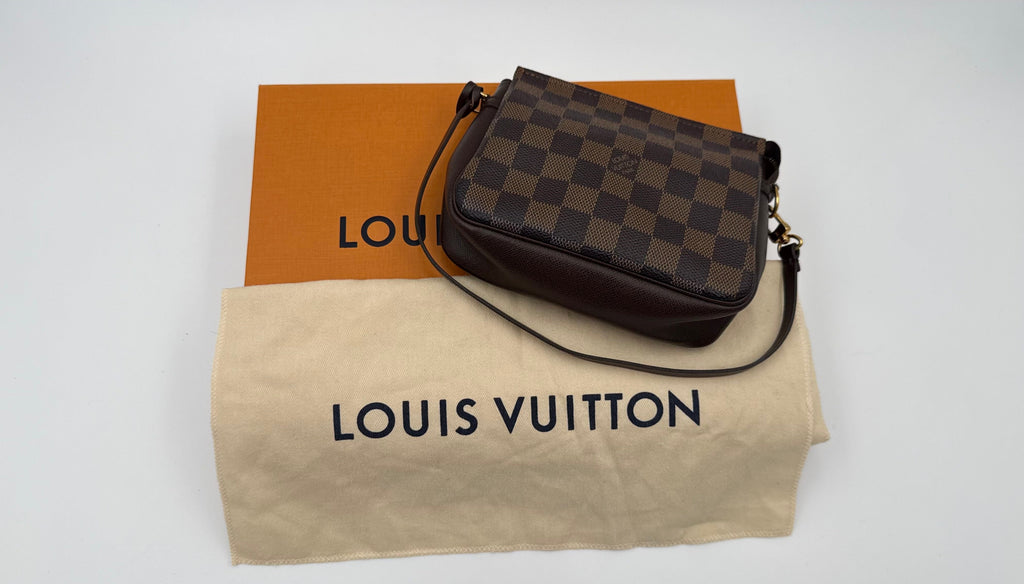 Louis Vuitton handbag on a branded Louis Vuitton bag with a white background