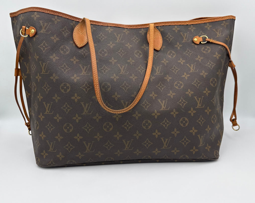 Designer handbag with monogram pattern on a white background