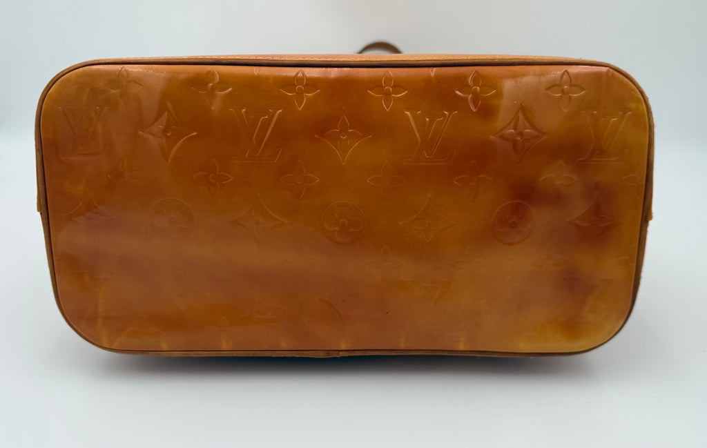 Louis Vuitton Vernis Houston tote in amber caramel patent leather with embossed monogram bottom of bag on white background
