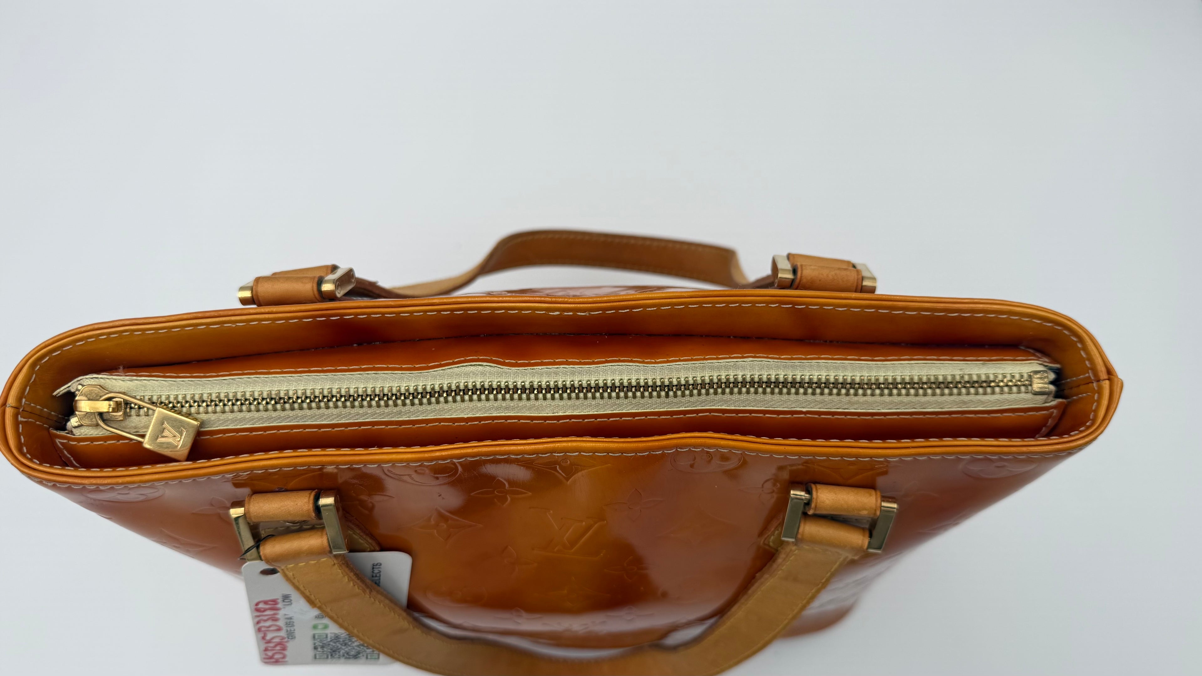 Louis Vuitton Vernis Houston tote top view showing zipper closure and amber caramel patent leather