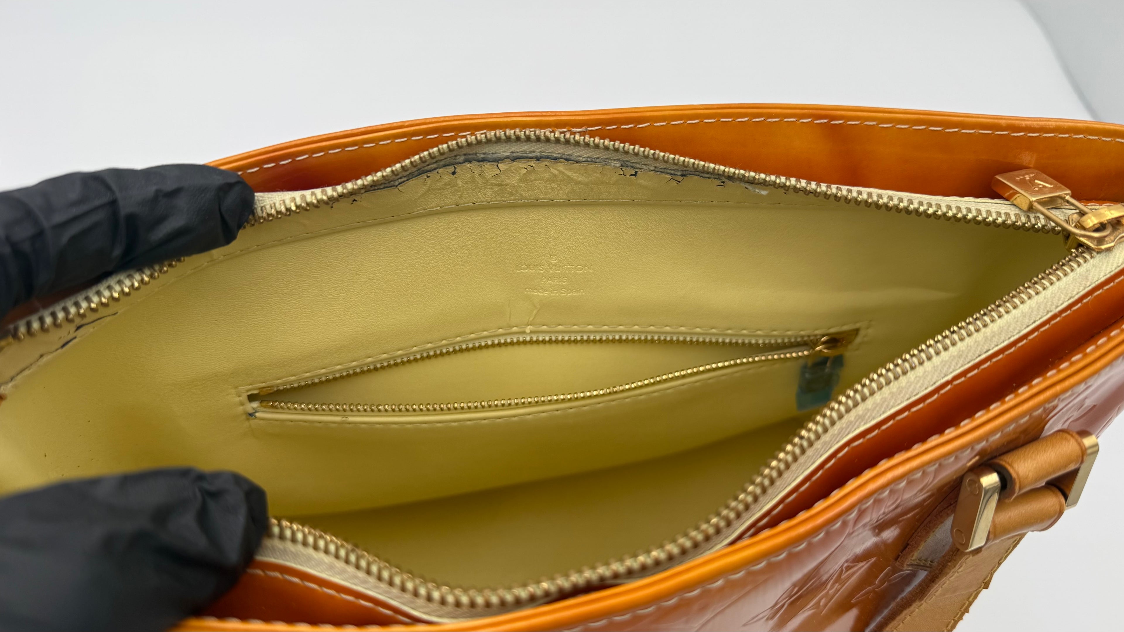 Louis Vuitton Vernis Houston tote interior showing zip pocket and light peeling near zipper