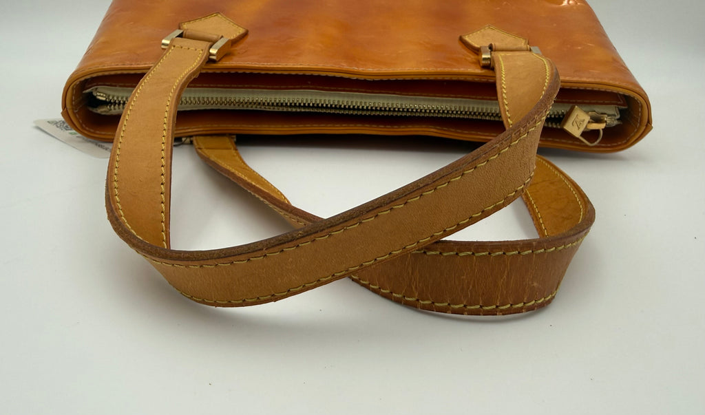 Louis Vuitton Vernis Houston tote handle straps showing wear and patina in amber caramel patent leather