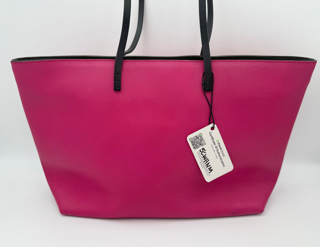 Pink tote bag with a tag on a white background