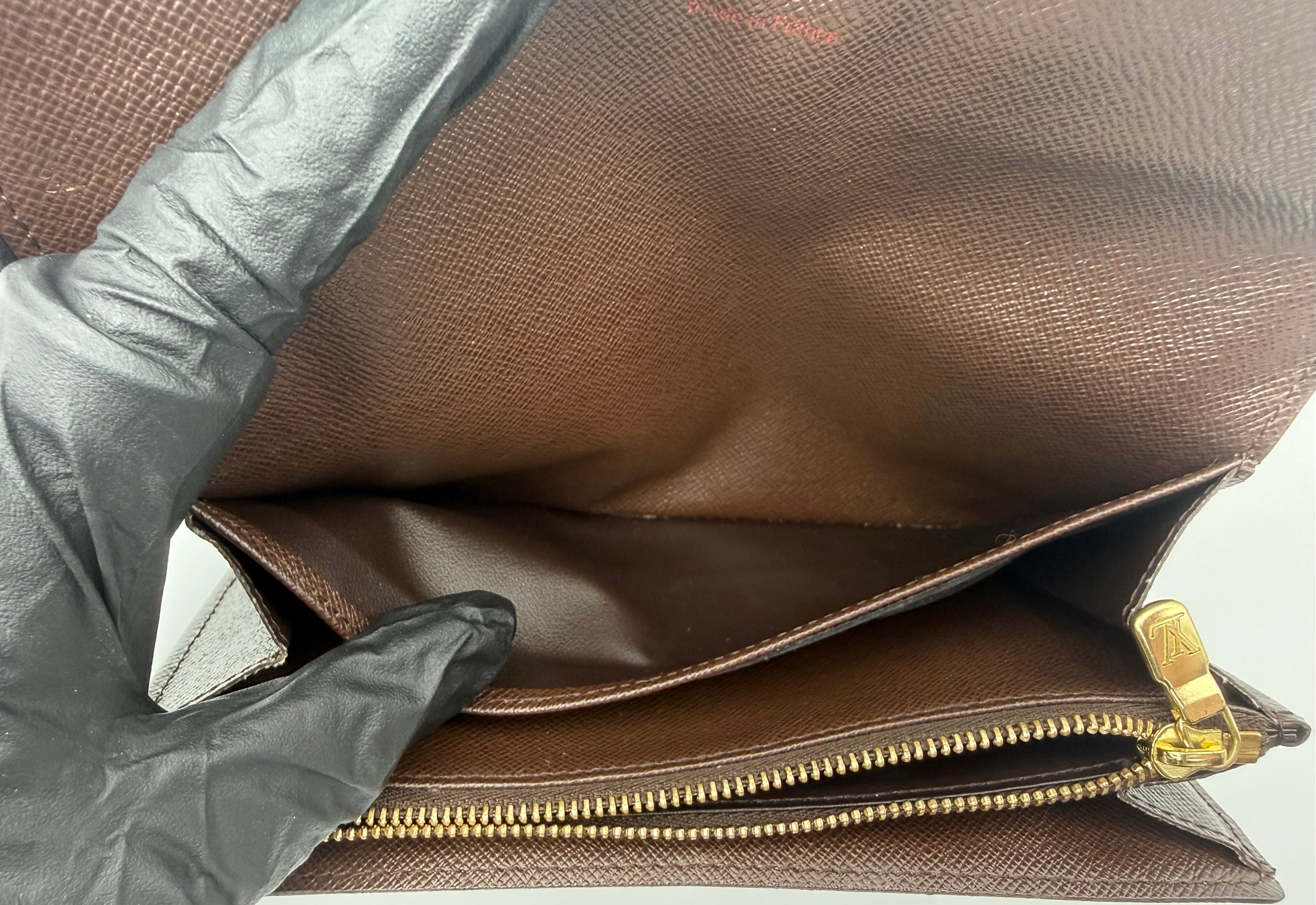 Louis Vuitton wallet interior compartment, clean brown leather lining