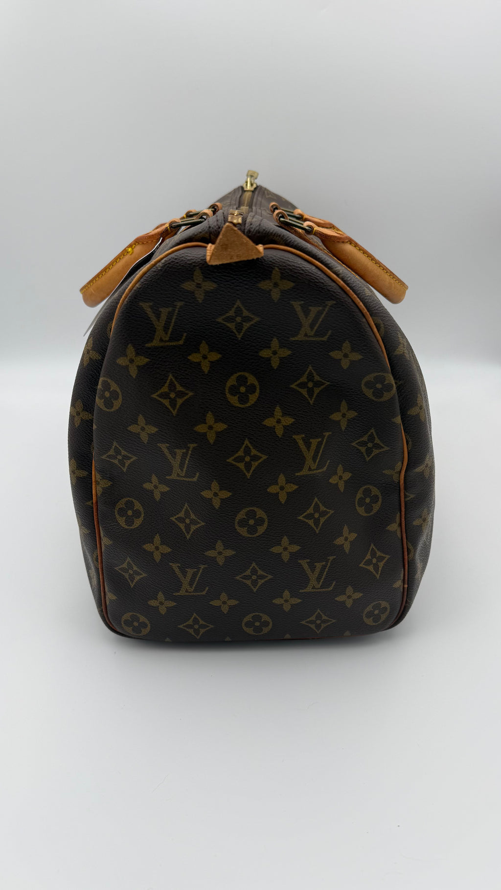 Louis Vuitton monogram duffel bag on a white background