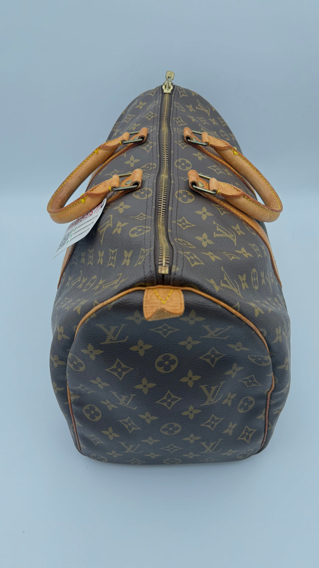 Louis Vuitton monogram duffel bag on a white background